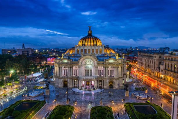 Palace of Fine Arts Dusk falls over the Palacio de Bellas Artes in Mexico City. historic building photos stock pictures, royalty-free photos & images