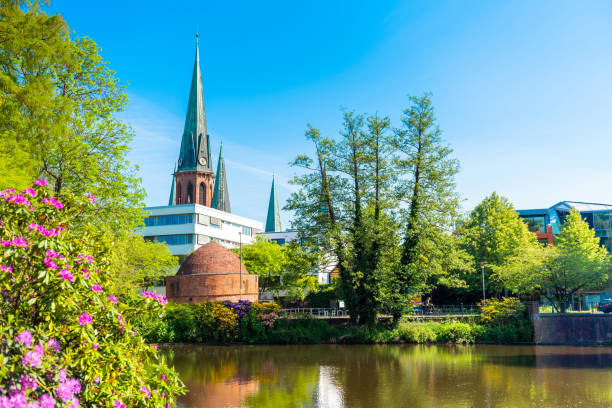 View of the pond and St. Lamberti Church of Oldenburg, Germany stock photo
