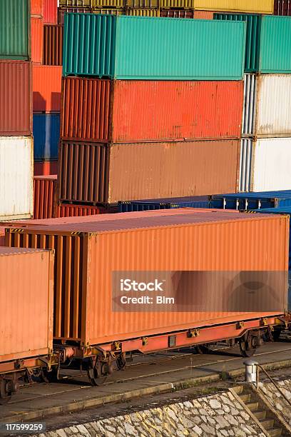 Cargo Containers Stacked At Harbor And Loaded On Train Wagons Stock Photo - Download Image Now
