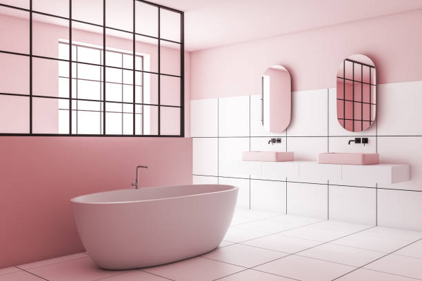 istock Pink and white tile bathroom corner, sink and tub 1175993084