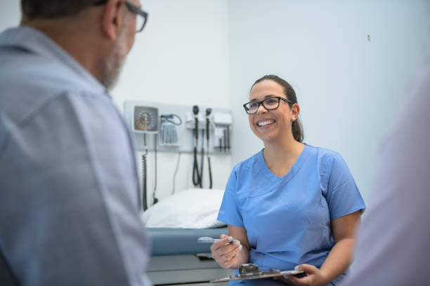 istock Smiling nurse gives medical advice 1175995816