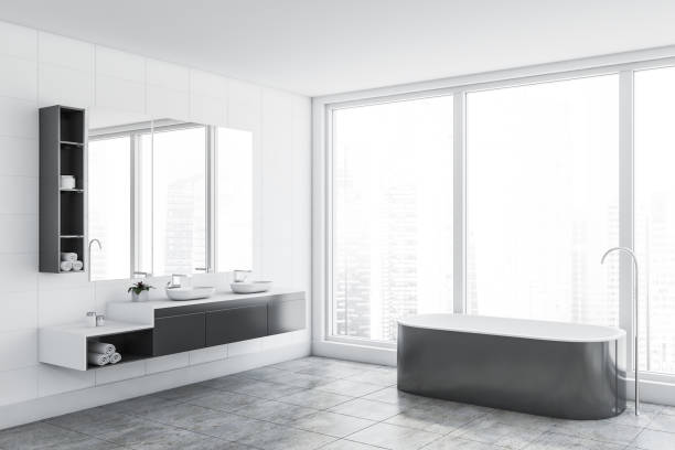 istock Panoramic white tile bathroom corner, tub and sink 1175995960