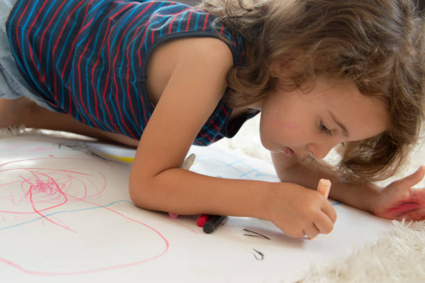 istock Little Girl drawing 1175997832