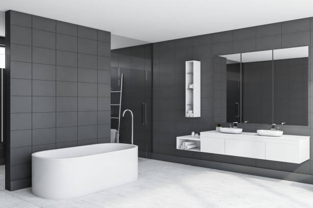 istock Gray tile bathroom corner, tub and sink 1175998305