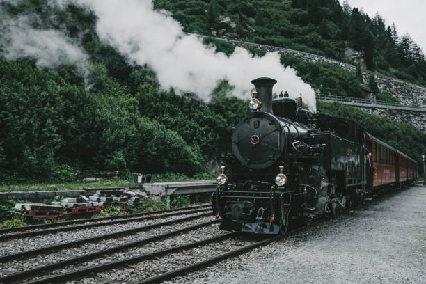 istock Old-fashioned steam train in Swiss Alps 1175998534