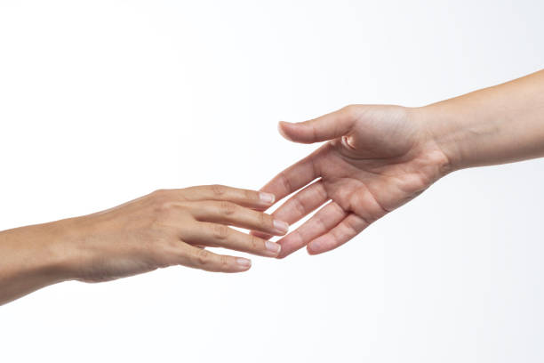 helping hand - reaching human hand handshake support imagens e fotografias de stock