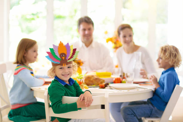 istock Family with kids at Thanksgiving dinner. Turkey. 1176010826