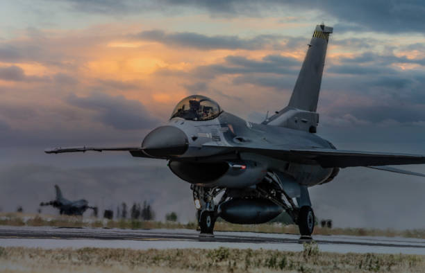 istock F-16 fighter plane ready to takeoff on runway at sunset 1176011506