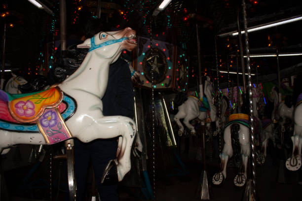 istock Horses carousel with coloured spotlights in Mexico 1176019311