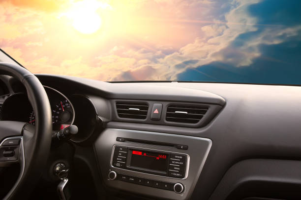 istock skyscape with the sun from the car through the windshield 1176019351