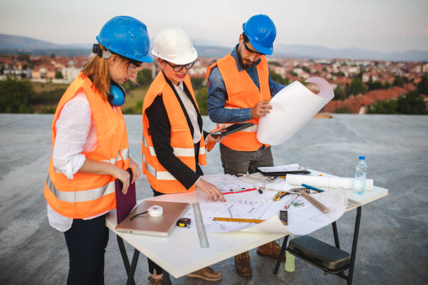 istock Teamwork of civil engineers at construction site 1176021848