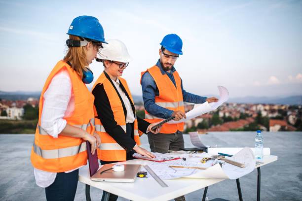 istock Teamwork of civil engineers at construction site 1176022056