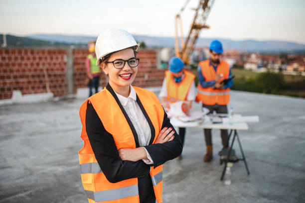 istock Joyful female civil engineer on construction site 1176022079