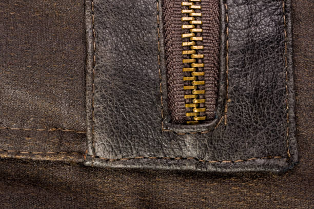 istock clothing items stonewashed cotton fabric texture with seams, clasps, buttons and rivets, macro 1176023412