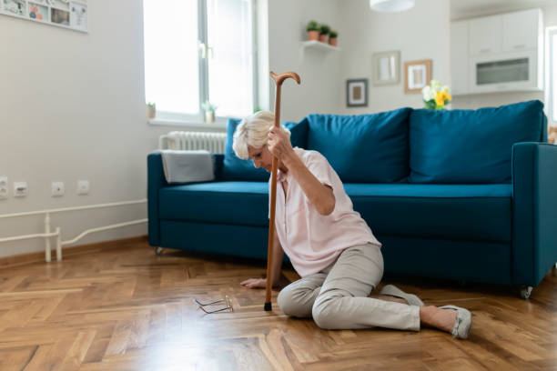 Having difficulty staying on her feet Senior Woman Suffering From Faint Lying on Floor After Falling Down at Home. Elderly Woman Fell on the Floor osteoporosis awareness stock pictures, royalty-free photos & images