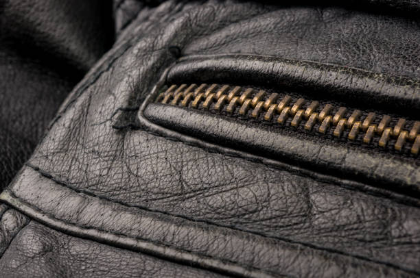 istock Old vintage genuine soft black leather texture background, top layer with pores and scratches, macro, close-up 1176025521