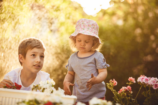 istock Cheerful sibling playing together in the garden 1176032297