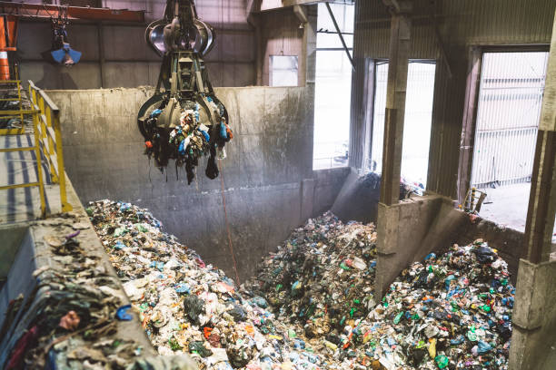 istock Machine picking up trash at recycling center 1176032460