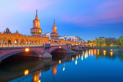 Berlin skyline with Oberbaum Bridge and Spree River, at sunrise, Germany