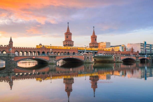 istock Berlin skyline with Oberbaum Bridge and Spree River, at sunrise 1176032749