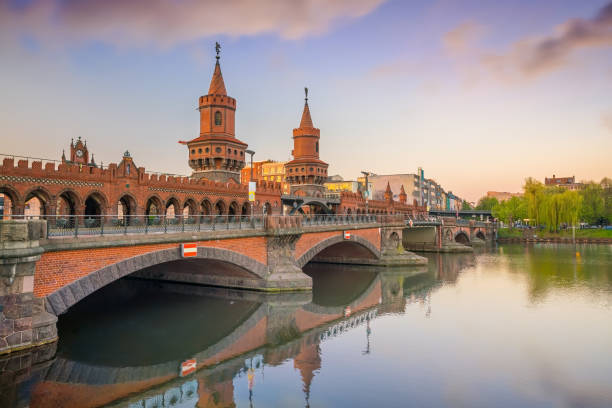 istock Berlin skyline with Oberbaum Bridge and Spree River, at sunrise 1176032751