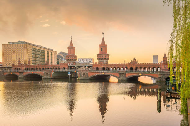 istock Berlin skyline with Oberbaum Bridge and Spree River, at sunrise 1176032752
