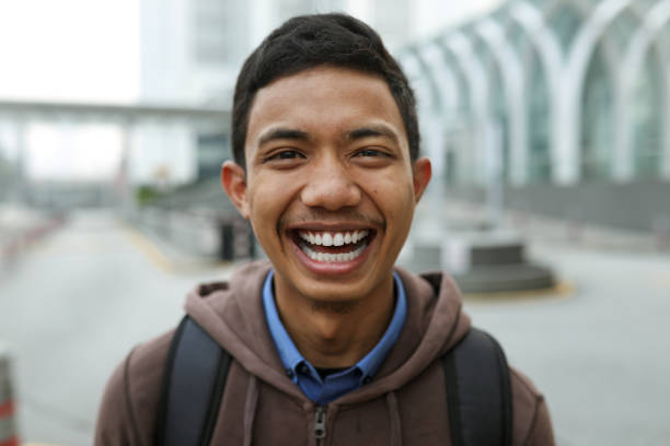 istock Portrait of smiling handsome young man 1176042777