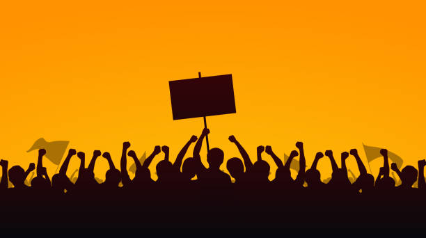 illustrazioni stock, clip art, cartoni animati e icone di tendenza di silhouette gruppo di persone alzato pugno e segni di protesta sullo sfondo giallo serale cielo - protestor