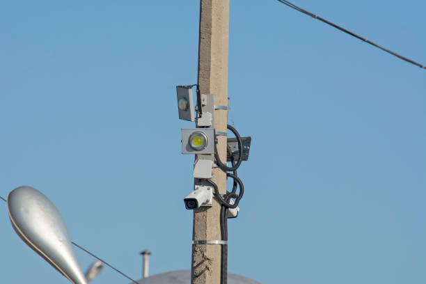 istock Street surveillance camera mounted on a pole with LED spotlights. 1176044842
