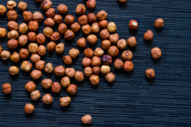 istock Ripe hazel nut for food. Organic food rustic banner template with text space. 1176047828