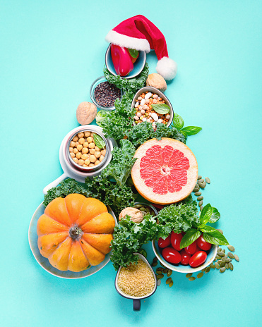 Christmas tree made from healthy food.. Vegan, vegetarian diet eating. Christmas Food background. Healthy holiday diet concept