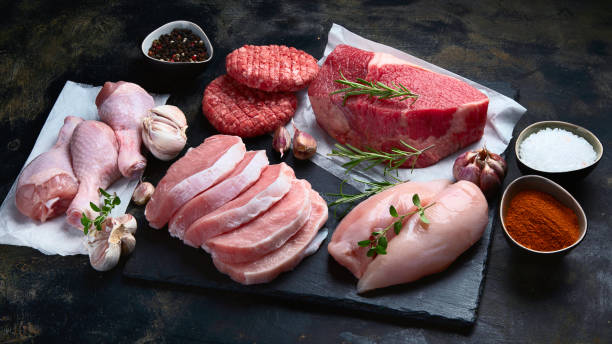 istock Raw meat assortment on black background. 1176053391