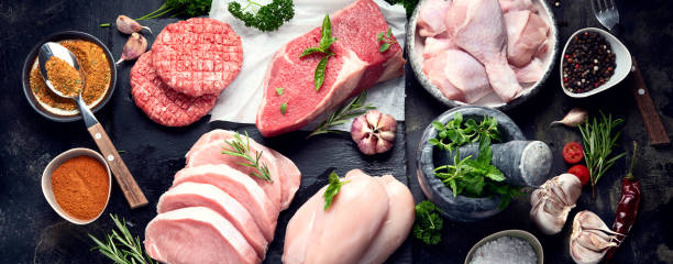 istock Raw meat assortment on black background. 1176054106