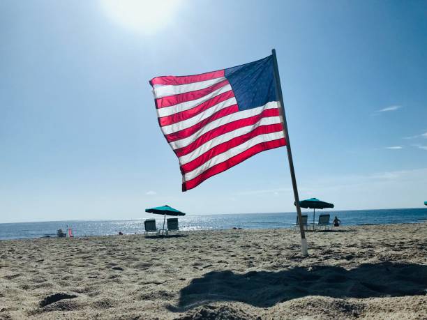 istock close up American flag on beach 1176054775
