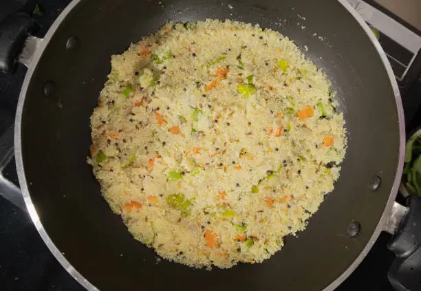 Photo of Prepared fresh Upma in Kadai or Cooking pan