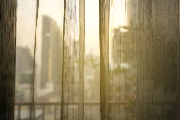 istock transparent curtain before urban city background and light filter 1176069562