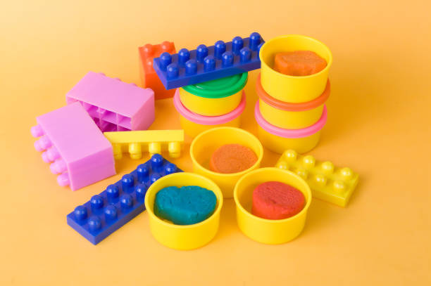 istock Colorful building blocks & Clay with yellow background for kids 1176074921
