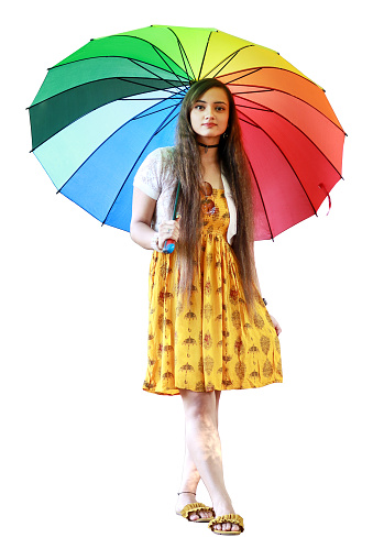 Happy woman standing in rain.  Rainy season.