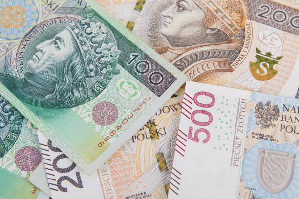 istock Polish banknotes chaotically scattered on the desk 1176078284