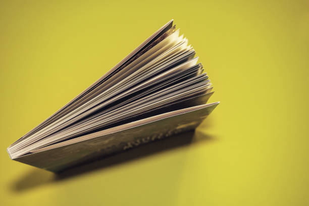 istock Beautiful book top view on a yellow background table. 1176079146