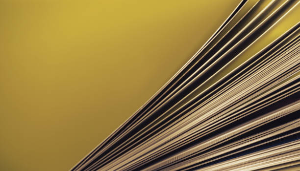 istock Close up beautiful book top view on a yellow background table. 1176079588