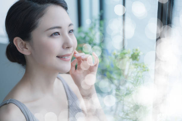 Beauty concept of a young asian woman. Skin care. Body care. Cosmetics. Beauty concept of a young asian woman. Skin care. Body care. Cosmetics. east asia photos stock pictures, royalty-free photos & images