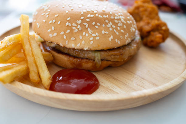 istock Fresh hamburger on a wooden plate 1176085875