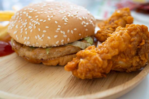 istock Fresh hamburger on a wooden plate 1176085900