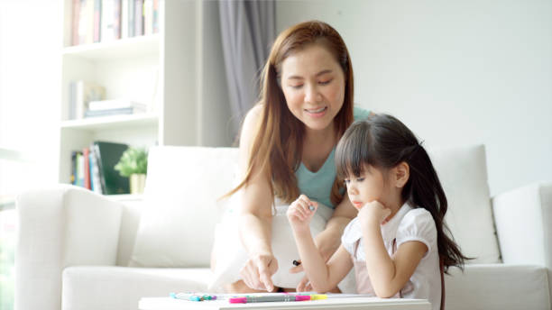 istock An Asian mother Teaching Her Daughter to Draw 1176086188