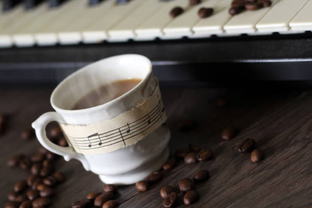 istock A Cup of hot coffee, musical notes and a piano. 1176087111