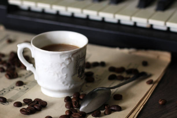 istock A Cup of hot coffee, musical notes and a piano. 1176087312