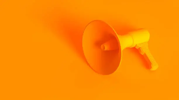 Portable wireless megaphone. Conceptual stereoscopic image full toned in orange color.