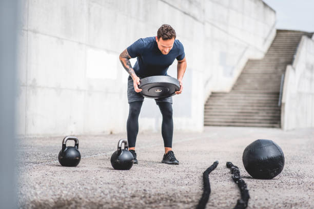 istock Young Male Athlete Doing Cross-Training Exercises Outdoors 1176094131