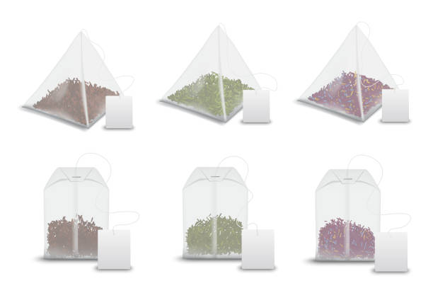 Tea bag pyramids, teabag tags realistic mockups Tea bag pyramids with labels, realistic 3D mockup templates. Vector isolated teabags, pyramids and rectangles with black and green tea leaf, fruit of floral brew bags with blank tags teabag stock illustrations